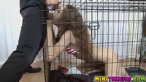 Dominant mistress uses a cage to punish her submissive