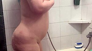 Big tits and big ass on display in a teasing shower